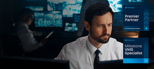 Man viewing monitors with Milestone XProtect